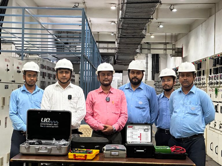 Testing and commissioning team with diagnostic instruments